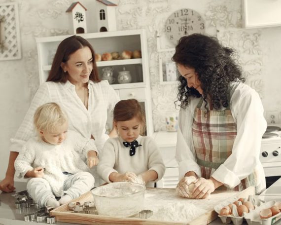 Three generations enjoying baking together in a cozy kitchen with natural light.